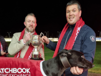 Ballymac Merlin, winner of the 2021 Matchbook Irish St.Leger Final at Limerick Greyhound Stadium for Liam Dowling Ballymac Kennels in a time of 29.68 with Paul Geasley of Matchbook Betting Exchange & Shane Dowling of Ballymac Kennels.