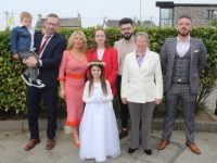 Lily Anna Sebestova with Joseph Sebest (holding Eli), Lorraine Sebestova, Sabhadh and Jack McMahon, Maureen and Dean O'Sullivan at the Holy Family First Holy Communion Day at Our Lady and St Brendan's Church on Saturday. Photo by Dermot Crean