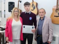 Gearóid Costello with Anne and Ger Costello at the Coláiste Gleann Lí Graduation Day on Friday. Photo by Dermot Crean