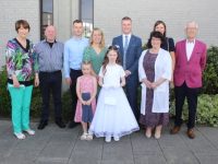 Emily Savage with Mary Savage, Brendan Savage, Shane Brien, Ciara Savage, Abbie Savage, Conor Hurley, Breeda Hurley, Linda Hurley and Sean Hurley at the Scoil Eoin Primary School First Holy Communion Day at Our Lady and St Brendan's Church on Saturday. Photo by Dermot Crean