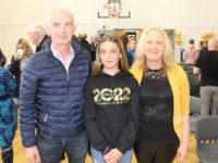 Sixth class pupil Kerri Falvey with parents Dave and Aine at St Brendan's NS Blennerville on Monday. Photo by Dermot Crean