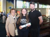 Pupil Mia Molloy with Dolly and Rory Molloy at the Listellick NS Graduation at Our Lady and St Brendan's Church on Monday. Photo by Dermot Crean