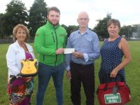 Sean Lynch (second from right) of Hogan's Tralee, presents a cheque to Thomas White of Tralee First Responders towards the cost of a new defibrillator. Also pictured is Audrey Moran and Mary Lynch. Photo by Dermot Crean