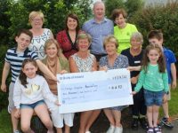 At the presentation of a cheque for €6,690 by the family of the late Harold Behan were, front from left; Charlie Small, Amelia Behan, Darel Behan, Maura Sullivan of Kerry Hospice, Ita Behan, Clinical Nurse Manager at the Palliative Care Unit Aine Moriarty, Isobel Behan and Rob Small. At back; Margaret Crean of Kerry Hospice, Caitriona Behan, Damien Behan and Bridie O'Connor of Kerry Hospice. Photo by Dermot Crean
