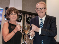 Kerry Person of the Year, Dr. Patricia Sheahan accepting the Crohan O’Shea perpetual trophy from President of the Kerry Association, Michael O’Regan.