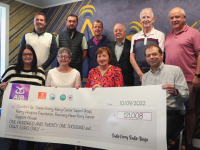 Representative from the four charities with the cheque for €121,008.