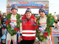 Rentokil Initial managing director Michael O'Mahoney with 2021 overall winners Paul Nagle and Craig Breen at the Killarney Historic Rally finish ramp last November