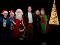 Padraig McGillicuddy of Ballygarry Estate and friends in front of the amazing Christmas tree on Wednesday evening. Photo by Dermot Crean