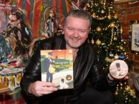Mark Leen with his new book 'The Postman And Doggie Woggie' which is a available to buy from The Nu Place Cafe on Bridge Street in Tralee. Photo by Dermot Crean