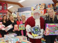 In front; Santa Claus and Sharon Sheehan launch the Toys Upstairs Toymaster Tralee Christmas Appeal for Adapt Kerry with, at back; Lauren Fitzgerald, Jessica Fox, Carla Griffin and Anne O'Sullivan. Photo by Dermot Crean