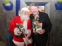 Santa and Mark Leen at the launch of Mark's book, 'The Postman and Doggie Woggie' at The Nu Place on Saturday. Photo by Dermot Crean