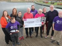 Martin and Deirdre Moore present a cheque to members of Down Syndrome Kerry (DSK) at the Tralee Bay Wetlands on Thursday. Included is, from left; Aoife Moynihan, Hugh O'Brien, Mags Quillinan (event organiser), Yann O'Carroll, Martin Moore, Cian Darcy, Deirdre Moore, Joanie McAuliffe (Tralee Bay Wetlands) Maurice Horan and Enda O'Brien of DSK. Photo by Dermot Crean