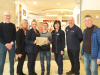 Staff of McCauley Tralee presenting a cheque for €1320 to Yann & Gerard O'Carroll on behalf of Down Syndrome Kerry. 
Funds raised through gift wrapping service. Much appreciation to all who donated to this worthy cause.