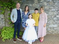 Caoimhe Fitzgerald with Mark, Kelly, Kian and Ciara Fitzgerald on First Holy Communion Day for St Brendan's NS Blennerville second class pupils on Saturday. Photo by Dermot Crean