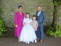 Addison Maunsell with Antoinette, Elliott and John Maunsell at the Moyderwell Mercy Primary School First Holy Communion Day at St John's Church on Saturday. Photo by Dermot Crean