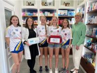 Our U15 Camogie team being presented with a fully stocked first aid bag by Grainne Ryle of Ryles Pharmacy Ashe St