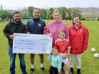 Tracy Barrett (pink top) accepting a cheque for €6,500 from Michael Moriarty (second left) of St  Pat's GAA Club with Tracy's husband Ricardo Gordillo, children Robyn and Rosa Gordillo and PRO of St Pats GAA Club Sharon Williams. Photo by Dermot Crean