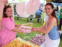 Kayla Burrows of Love and Frosting presents some macarons to Kerry Rose Kelsey McCarthy at the Island of Geese on Saturday. Photo by Dermot Crean