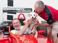 David Slattery having the craic with Buster the dog while enjoying sitting in a real rally car at the launch of The Brian O’Neill Garden Equipment and Trailers Ballyfinnane Festival of Speed in the mid-Kerry village on Monday evening.  Photo: Michelle Breen Crean