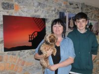 Rebekah Wall with son Reuben and 'Margaret' with one of the photos in the Days Like These exhibition at Maddens Cafe. Photo by Dermot Crean