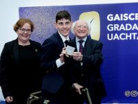 Ciaran Sears receives his Gaisce Gold Medal from President Michael D Higgins.