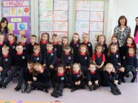 The new Junior Infant class at Listellick School on Tuesday morning with teacher Ashley Reynolds, Principal Annette Dineen and Marie Dineen. Photo by Dermot Crean