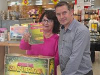 Pictured is Mairéad Kennedy, Cloonties, Ballyferriter, the first customer to submit her 'Team Of The Century' player picks at Garvey's Supervalu DIngle under the watchful eye of Kevin O'Connor, Garvey's Supervalu Dingle Store Manager.