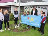 David Moran with teachers Laura Daly, Aileen Twomey an Sinead Bhreathnach and pupils with the Active School Flag on Wednesday. Photo by Dermot Crean