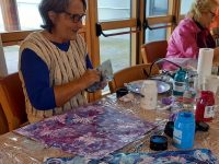 TAG member, Daireen Mc Mullen Browne, playing with acrylics at a recent TAG Paint Together in Baile Mhuire Day Centre, Tralee.