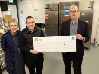Ben Keohane (right), CEO and Founder of Snap4Meals, presents a cheque to €15,000 to Paddy Kevane of Tralee Meals On Wheels. Also pictured is Tracy Noone, Development Officer with the National Meals On Wheels Network. Photo by Dermot Crean