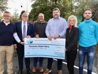Dermot Crowley of Recovery Haven (second from left) accepts a cheque from Aspen Grove staff, from left; Ed O'Regan, Manjit Gil, Mike McAuliffe, Maeve Townsend and Derek Maye. Photo by Dermot Crean