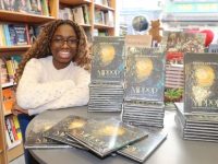 Abigail Adetunji with her first book of poetry, 'Mirror' at O'Mahony's Bookshop on Saturday. Photo by Dermot Crean