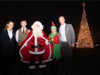 Padraig McGillicuddy (right) with Santa Claus and staff members Sarah Barrett, Owen Keely and April O'Connor with the spectacular Christmas tree at Ballygarry Estate on Thursday. Photo by Dermot Crean