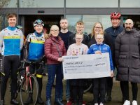 At the presentation of a cheque, the proceeds of the Cycle For Martong were, front from left: Maureen Lacey, Jessica Lacey, Emma Lacey.Back (Left to Right): Cathal Moynihan, Matt Lacey, James Lacey, Ethan Lacey, Aisling Lacey, Daithí Creedon, John James Griffin. Photo credit is attributed to George Doyle, Neustock Media