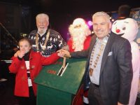 Mary Kerins and Tralee Chamber President Stephen Stack turn on the Christmas lights watched by Santa and Mayor of Tralee Johnnie Wall. Photo: Dermot Crean
