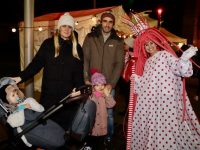 The Counihan family with a new friend at the Christmas market at the Island of Geese on Friday. Photo by Dermot Crean