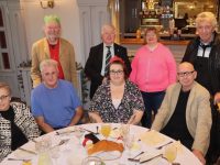 Standing; Noel King, Pat Mahoney, Grace Mahoney and Tom O'Brien, seated; Claire McCarthy, Edmund Quirke, Helen Keane and Darius Bartnik at the North Kerry Branch of the Irish Wheelchair Association Christmas Party on Sunday in The Meadowlands Hotel. Photo by Dermot Crean