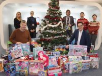 Junior Locke of SVP comes to collect the toys bought thanks to the generosity of the staff at JRI America. Included in front is JRI America Inc. Ireland Country Head Shane Walsh and at back; Rachel O'Sullivan, Michelle Hegarty, Sergey Udaltsov, Richard Kiely and Vicky Coates at JRI America in Kerry Technology Park on Friday. Photo by Dermot Crean