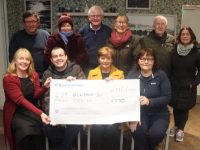 Paddy Kevane (seated second left) accepts a cheque from members of the Curraheen Community Choir at O'Shea's Gala Blennerville on Thursday. Also included are Sarah Noonan, Mary O'Shea and Helen Nelligan. Back from left; Brendan O'Brien, Maria Madden, Fionnbar Walsh, Phil Leen, Jack Lacey and Cathy O'Grady. Photo by Dermot Crean