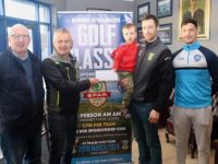 James Godley with his son Seamus being presented with his €500 winnings by Kerins O'Rahillys club chairman Oliver Molloy in the presence of Pat Flavin, PRO and seller Rob O’Connor. Photo by Dermot Crean