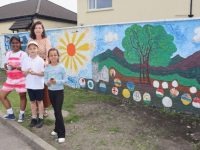 Teacher Muireann McCoy with pupils in front of the mural at St John's Parochial School on Thursday morning. Photo by Dermot Crean