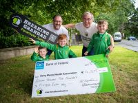 Dan O'Donoghue presents a cheque for €11,500 to the Kerry Mental Health Association. Also included I General Manager of KMHA John Drummey and Dan's grandchildren. Photo by Domnick Walsh